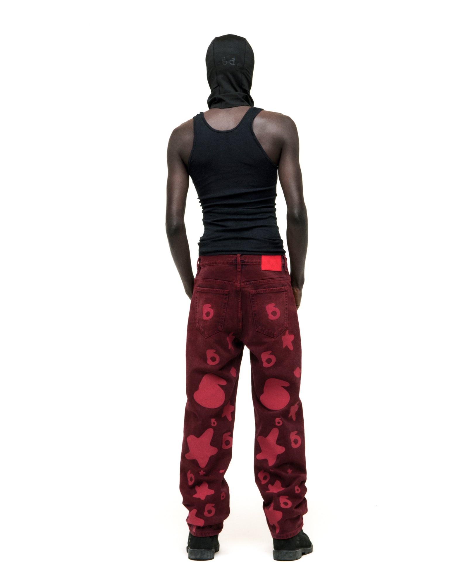 BELUGA DENIM faded wash red jeans with custom "6" and star print, branded hardware, and leather back patch.