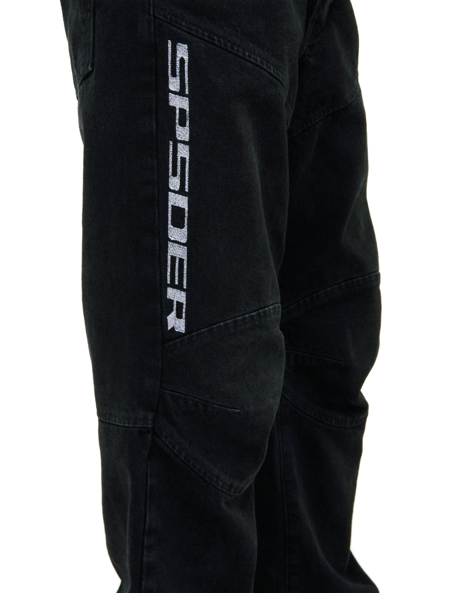 Black faded wash denim pants with "SP5DER" logo, paneled knees, and distressed details.