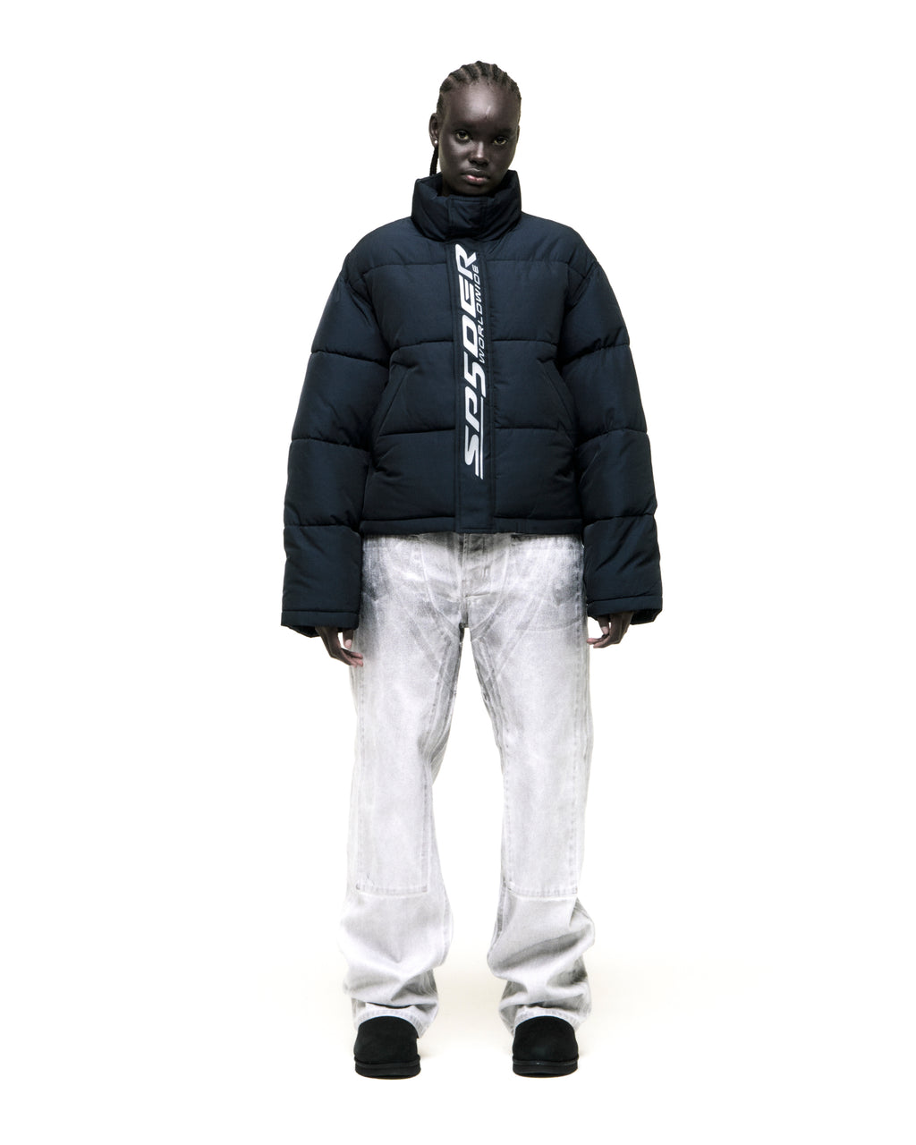 TRACKHAWK Puffer Jacket: Dark blue poly-fill jacket with reflective "SP5DER WORLDWIDE" text graphic along front zip.