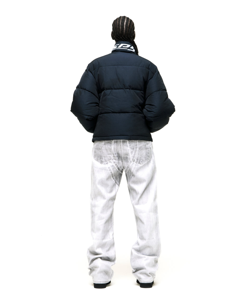 TRACKHAWK black poly-fill puffer jacket with reflective text graphic at back neck collar.
