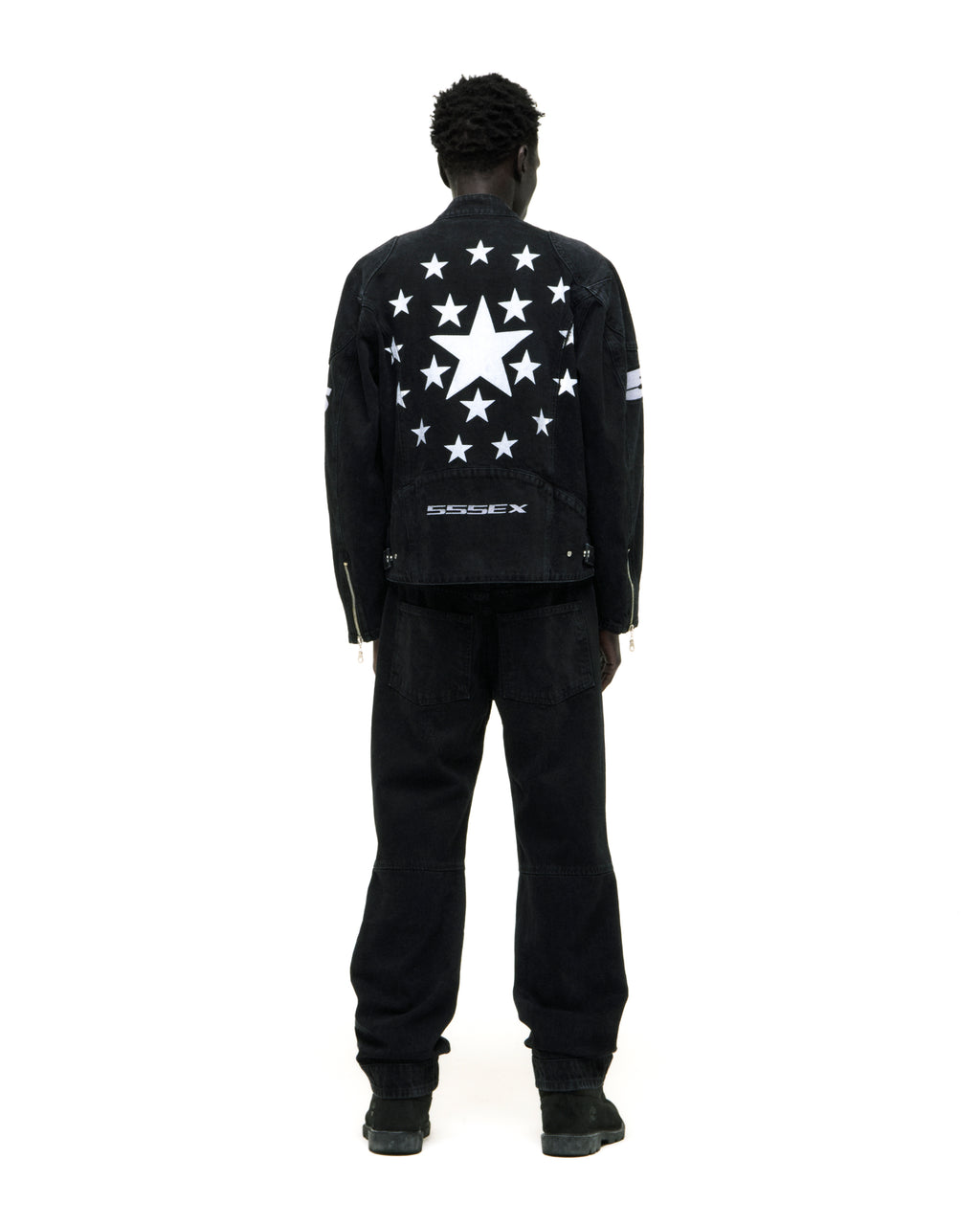 Black faded wash denim jacket with white star print on back and "SSSEX" embroidery.