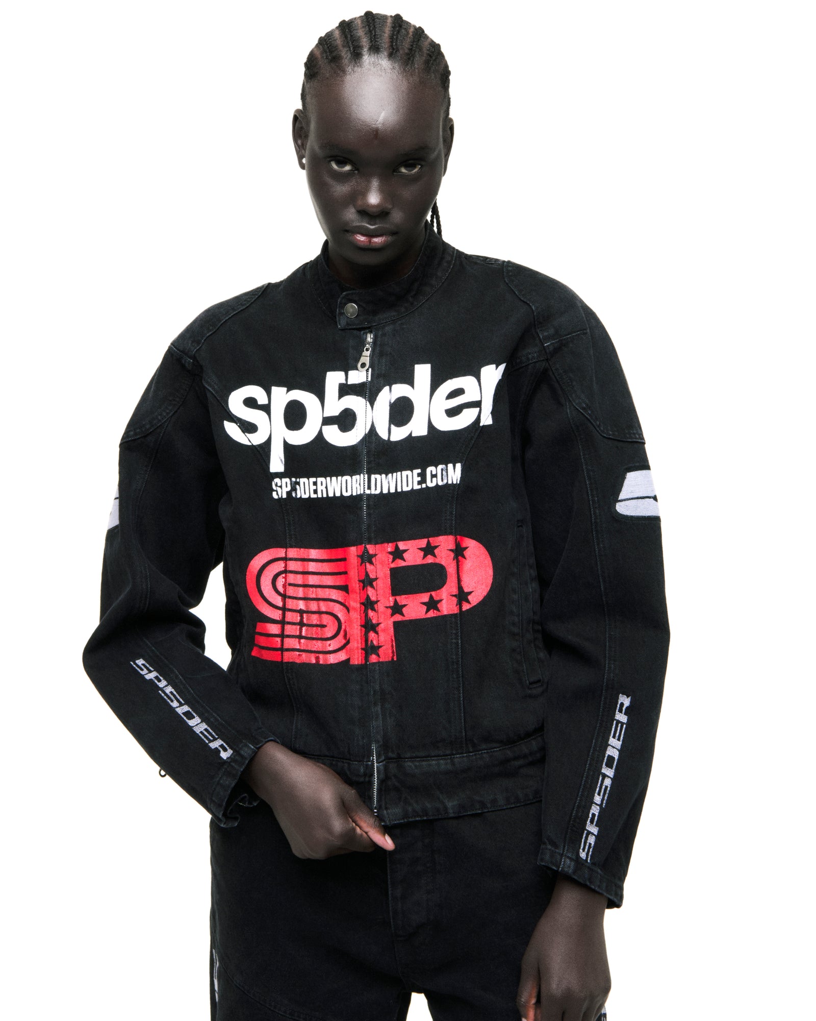 Black faded denim Motorsport jacket with white SP5DER chest print, red star graphic, and arm patches.