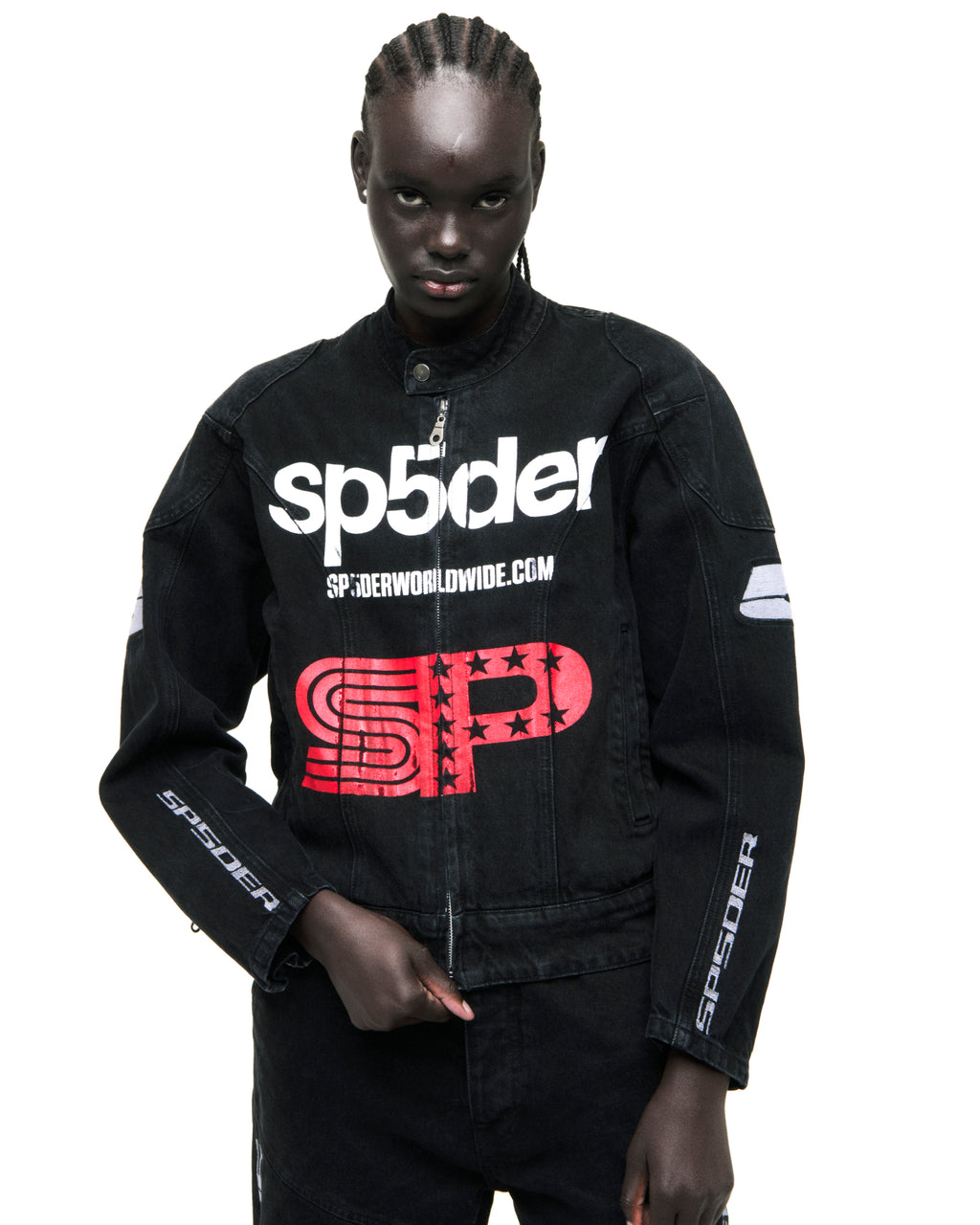 Black faded denim Motorsport jacket with white SP5DER chest print, red star graphic, and arm patches.