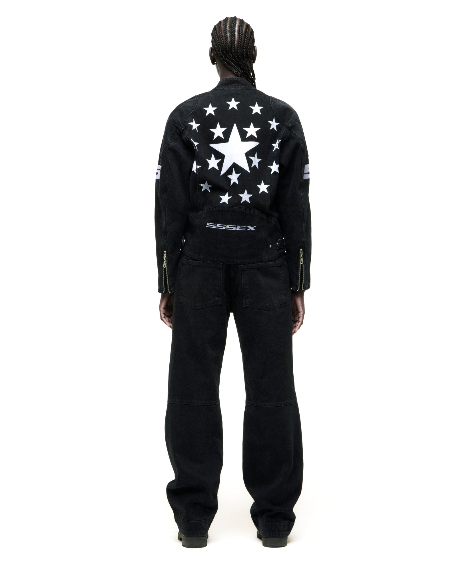 Black faded wash denim jacket with large white star design on back, zip closure, and cuff expansion.