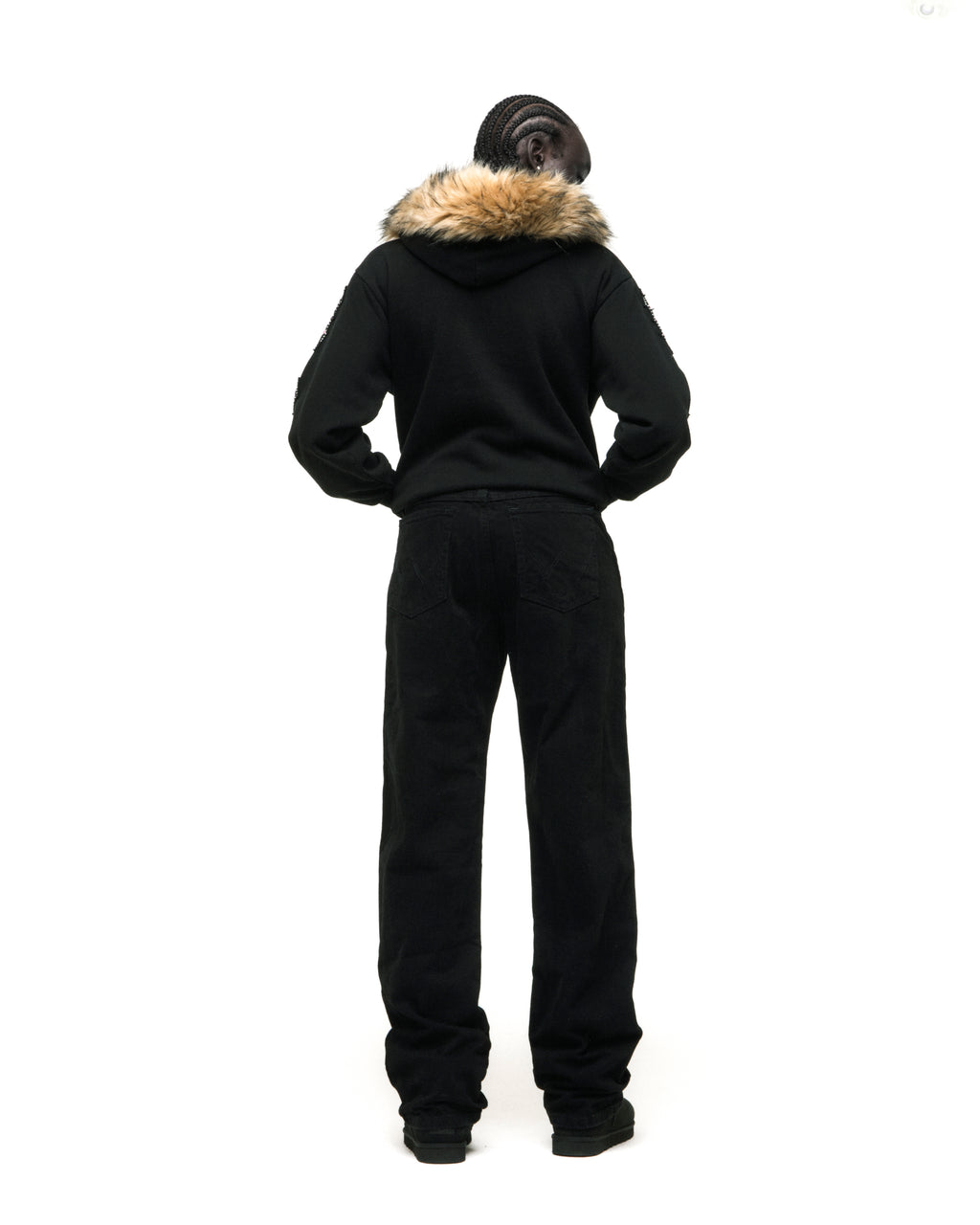 Black 13oz cotton fleece Garibaldi zip-up with faux fur hood trim, patterned sleeve accents, and studded pockets.