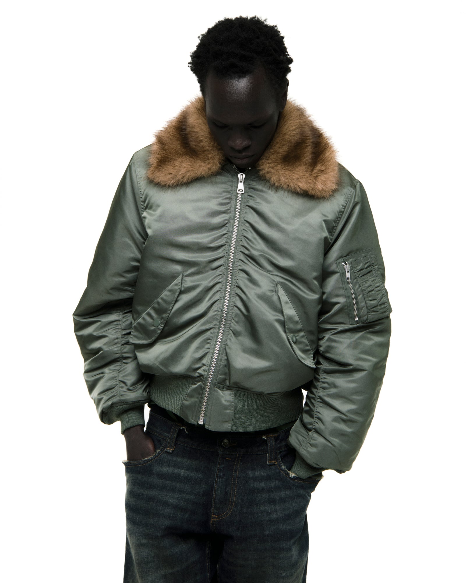 Green nylon bomber jacket with a brown faux fur collar, front zip, and sleeve utility pocket.