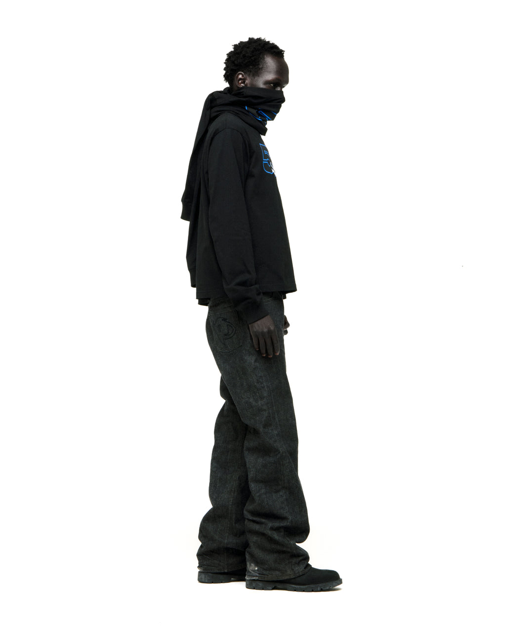 Black 555 SP5DER long sleeve tee with blue graphic, worn by a model in dark jeans.