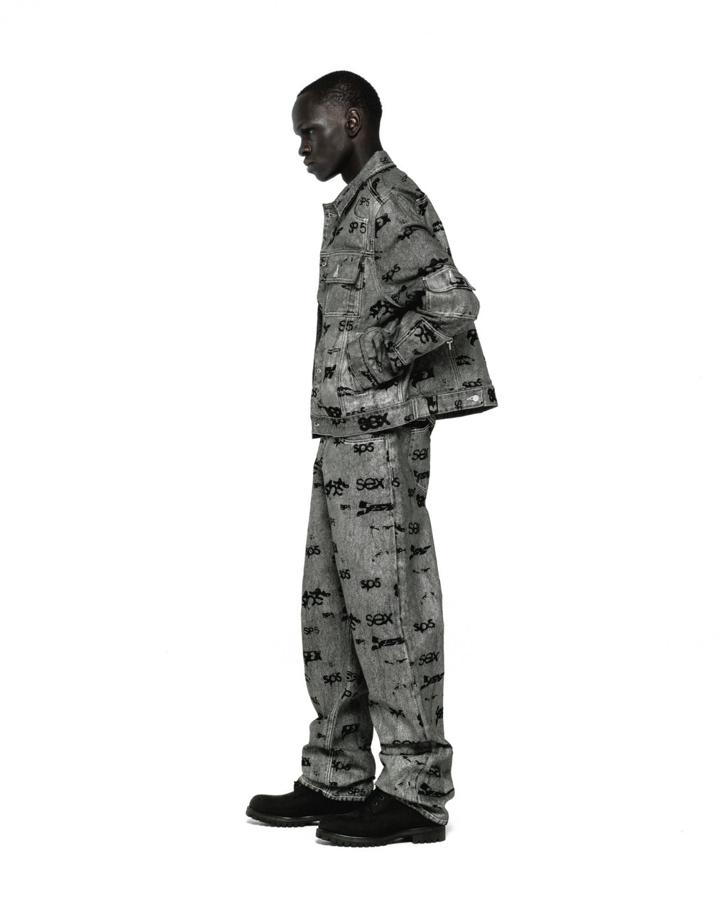 Grey denim trucker jacket and matching pants with all-over "SEX" print, red contrast stitching.