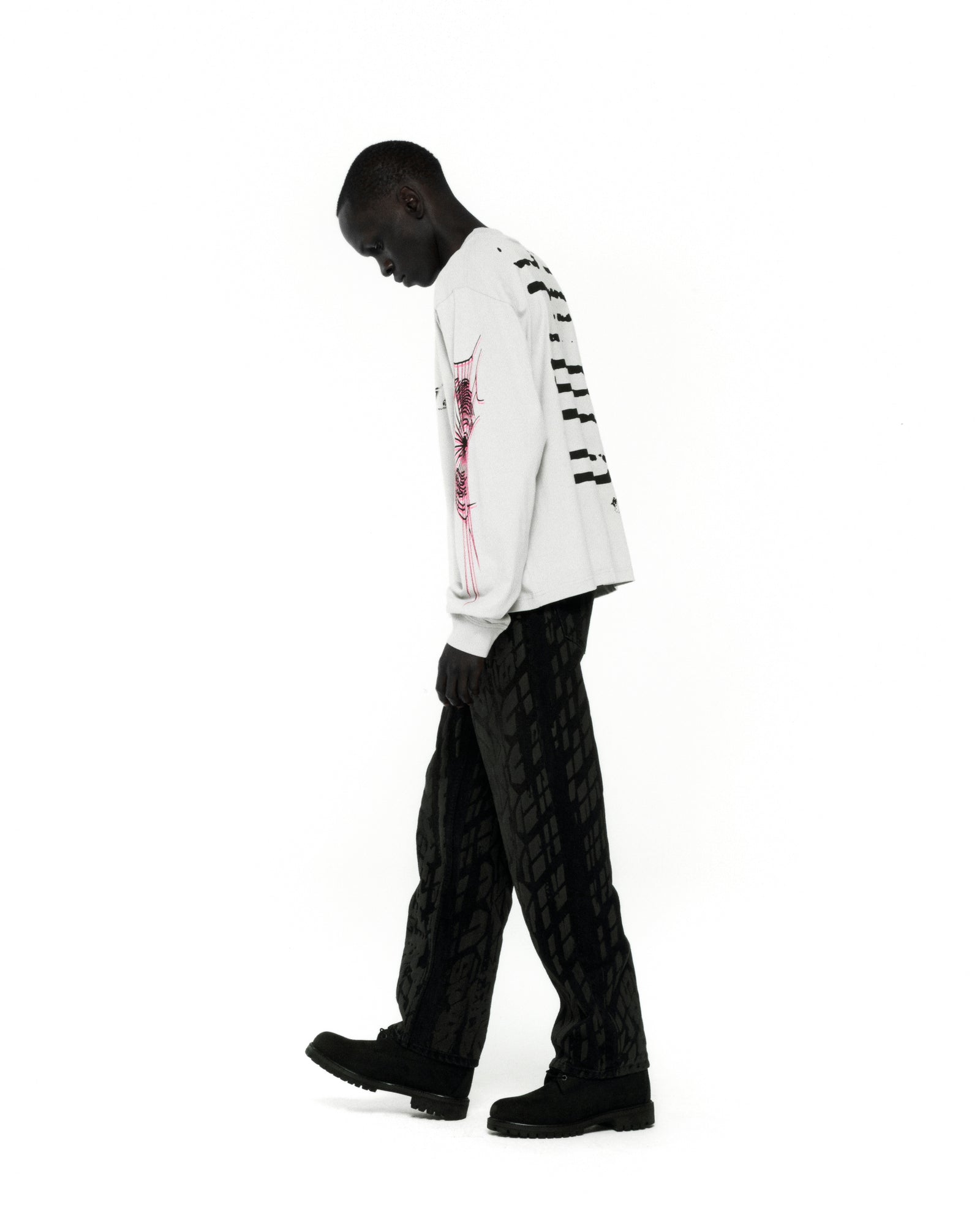 White 100% cotton WAIT LONGSLEEVE tee with graphic print on front, back, and sleeves.