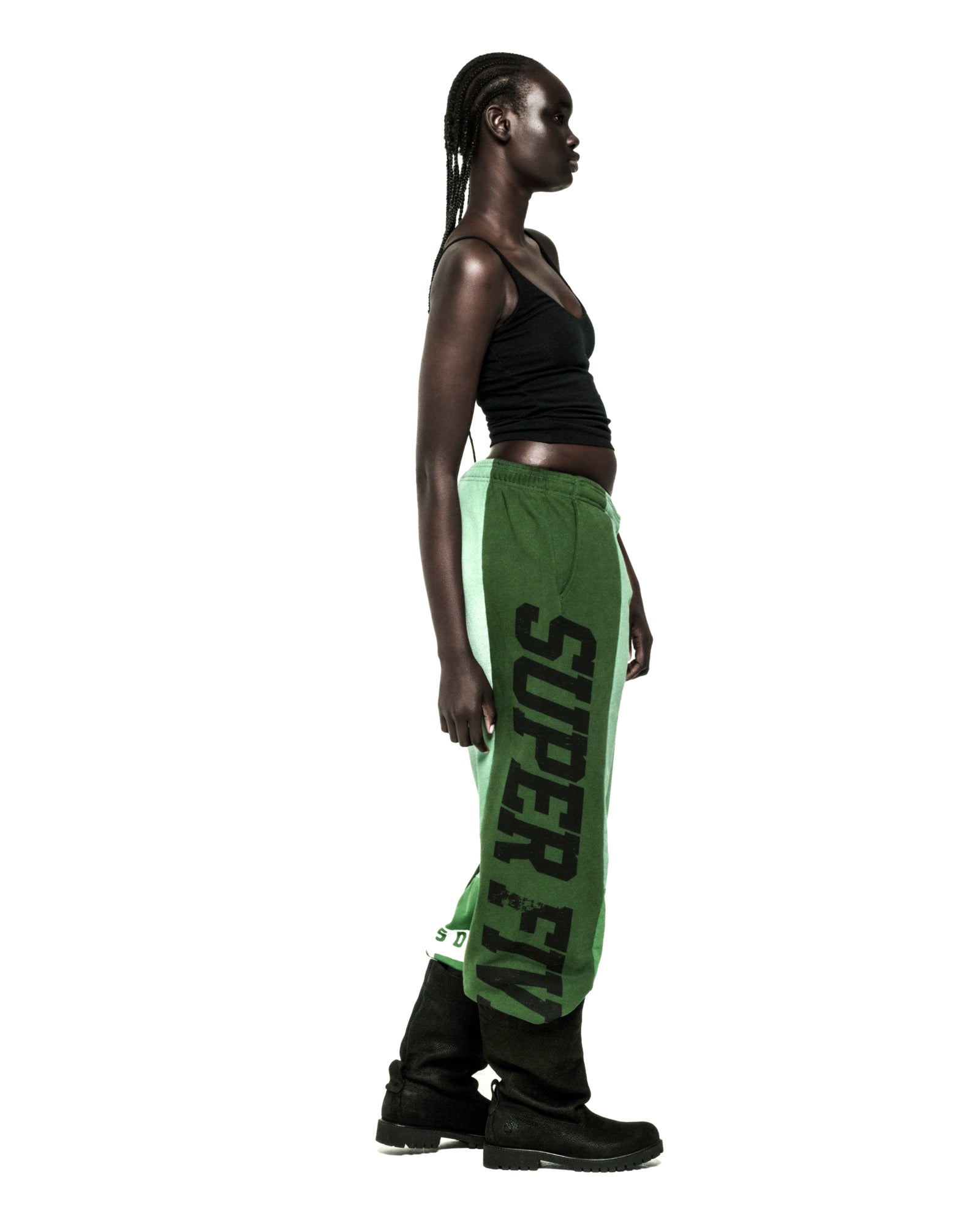 SUPERFIVE green cotton fleece sweatpants with contrast panel and "SUPERFIVE" graphic print.