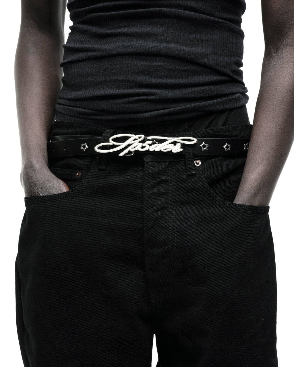 Black leather R-05 Script Belt with silver cursive SP5DER buckle, studded star grommets, and silver tip.