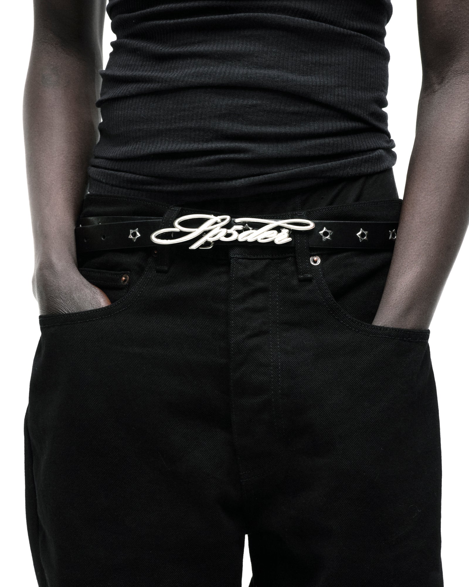 Black leather R-05 Script Belt with silver cursive SP5DER buckle, studded star grommets, and silver tip.