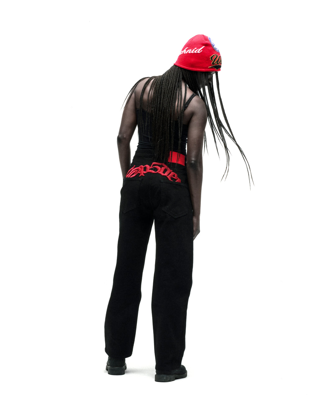 Black 13oz denim straight leg jeans with red embroidered text above back pockets.