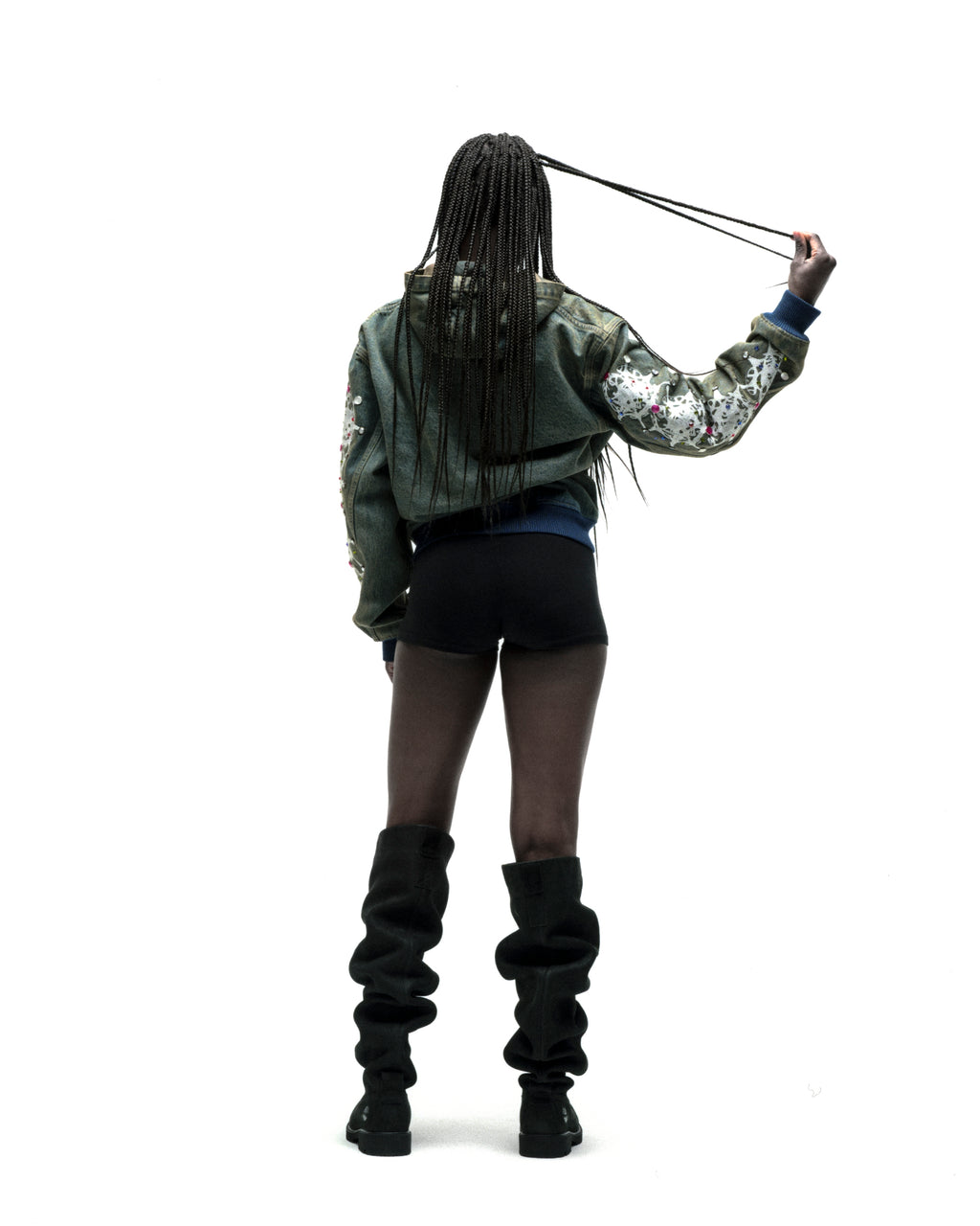 Faded denim jacket with web print and rhinestones on sleeves, rib-knit hem/cuffs.