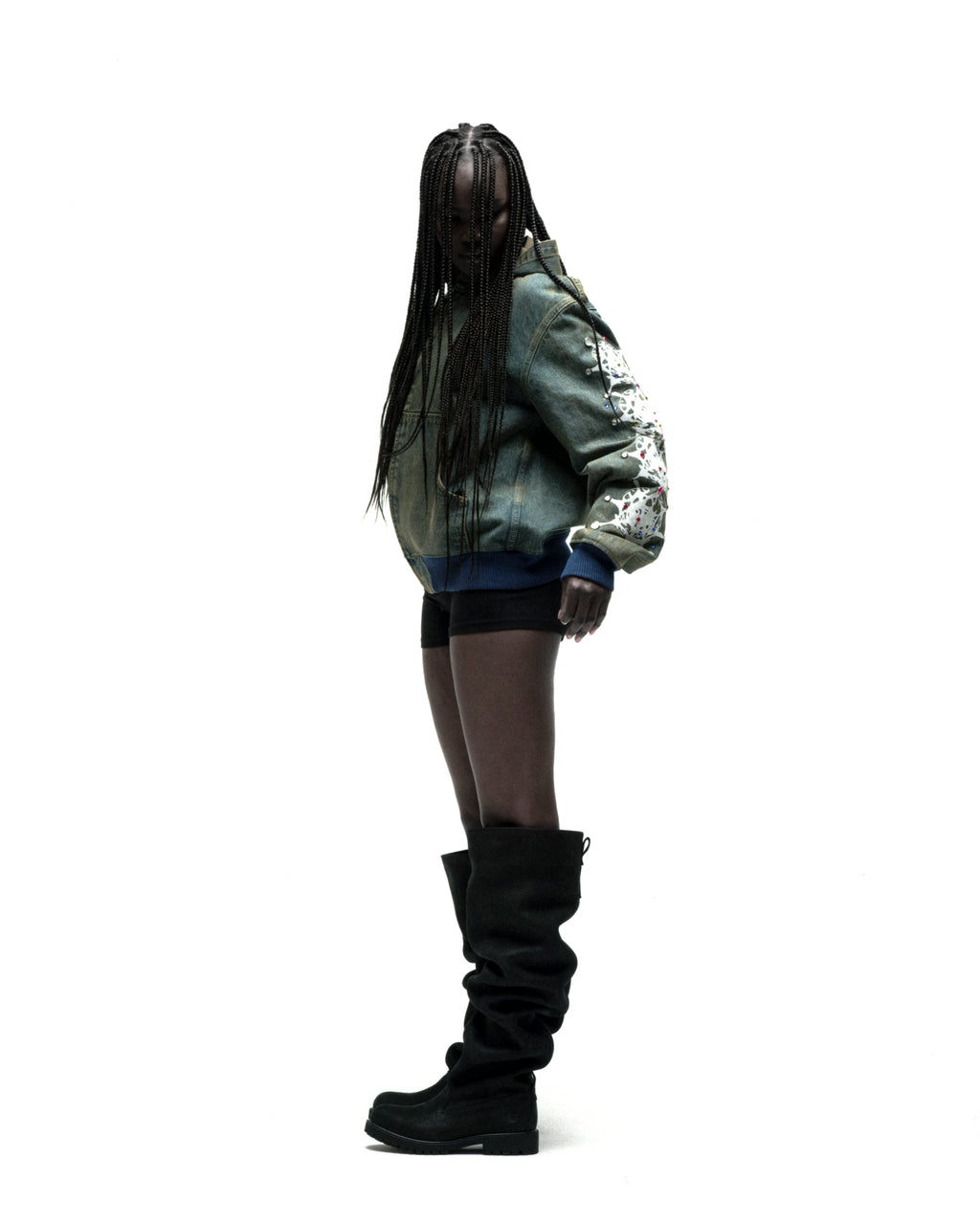 Faded denim hooded jacket with web print, rhinestone sleeves, zip closure, and patch pockets.
