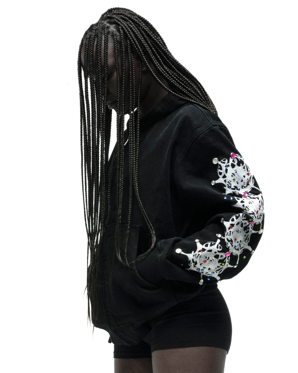 Black cotton canvas hooded jacket with web print and rhinestone sleeves.