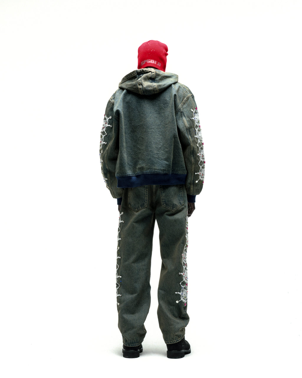 WEBSTONE faded denim hooded jacket with web print, rhinestones on sleeves, and matching pants.