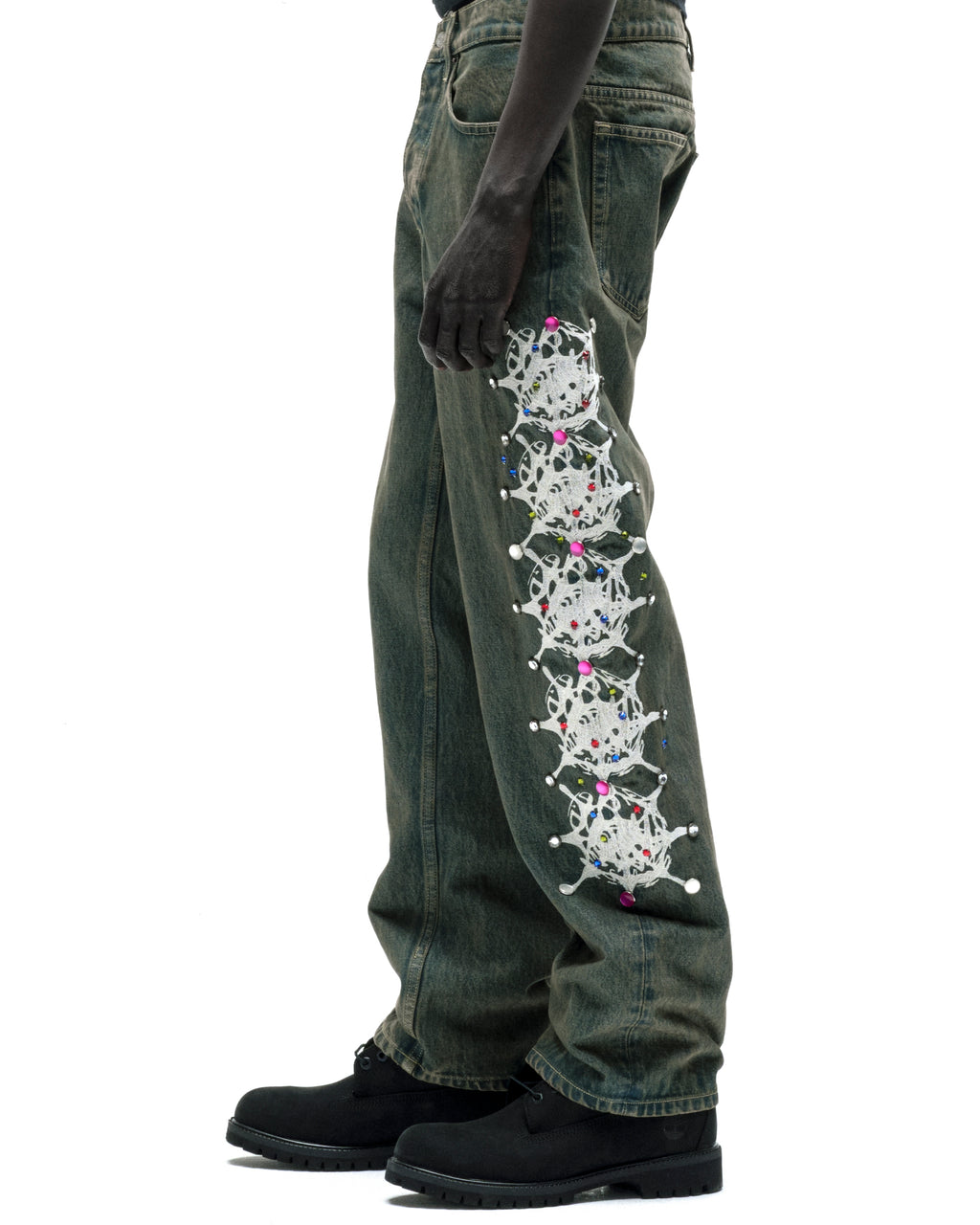 Vintage wash 13oz denim pants with white web print and colorful rhinestone embellishments down the leg.