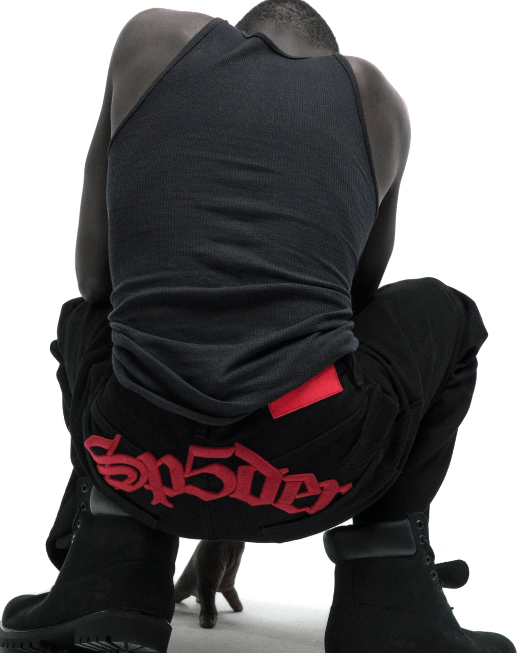 Black OXY JEANs with red embroidered text above back pockets, classic straight leg fit.