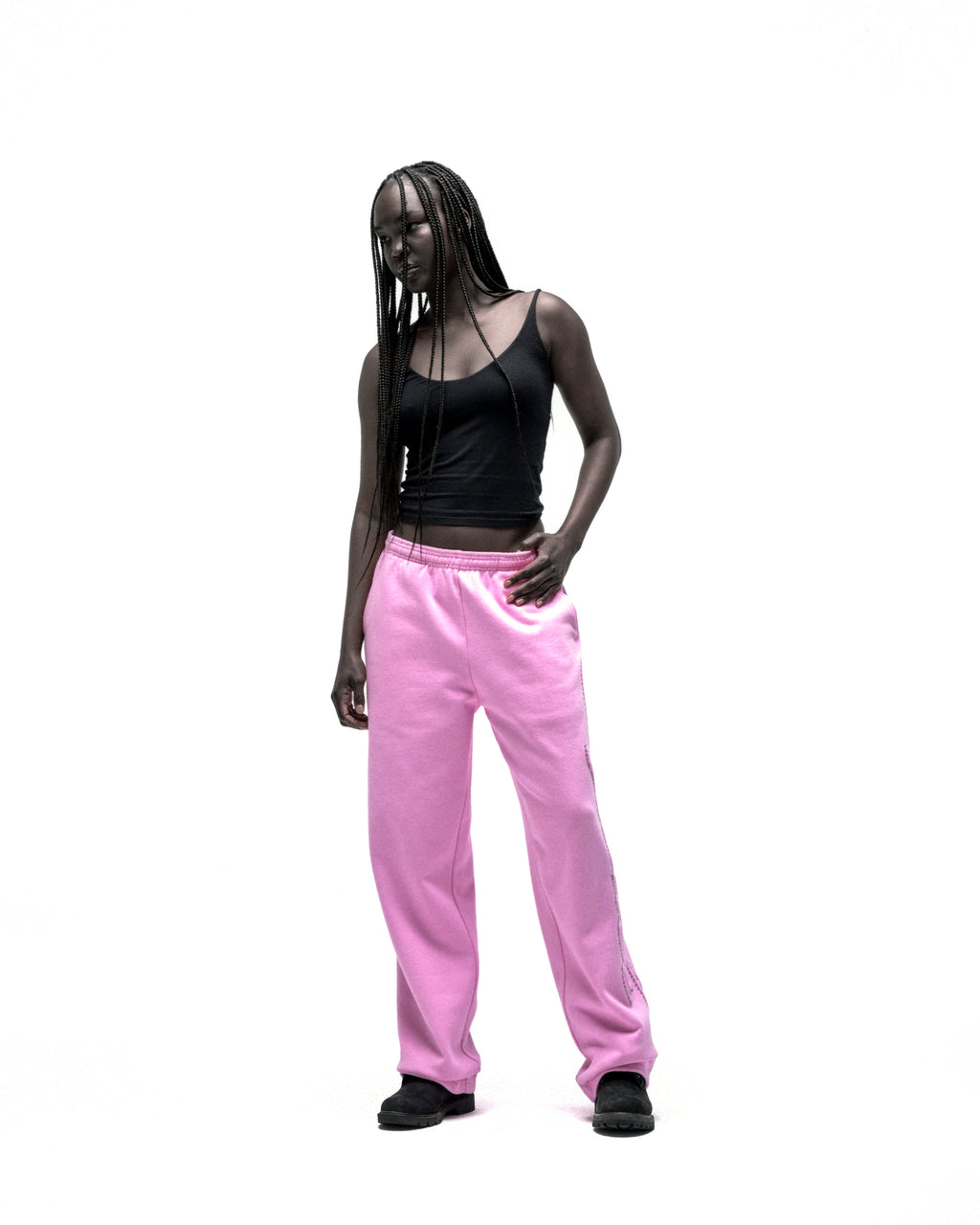 Pink cotton fleece wide-leg sweatpants with rhinestone script down the leg.
