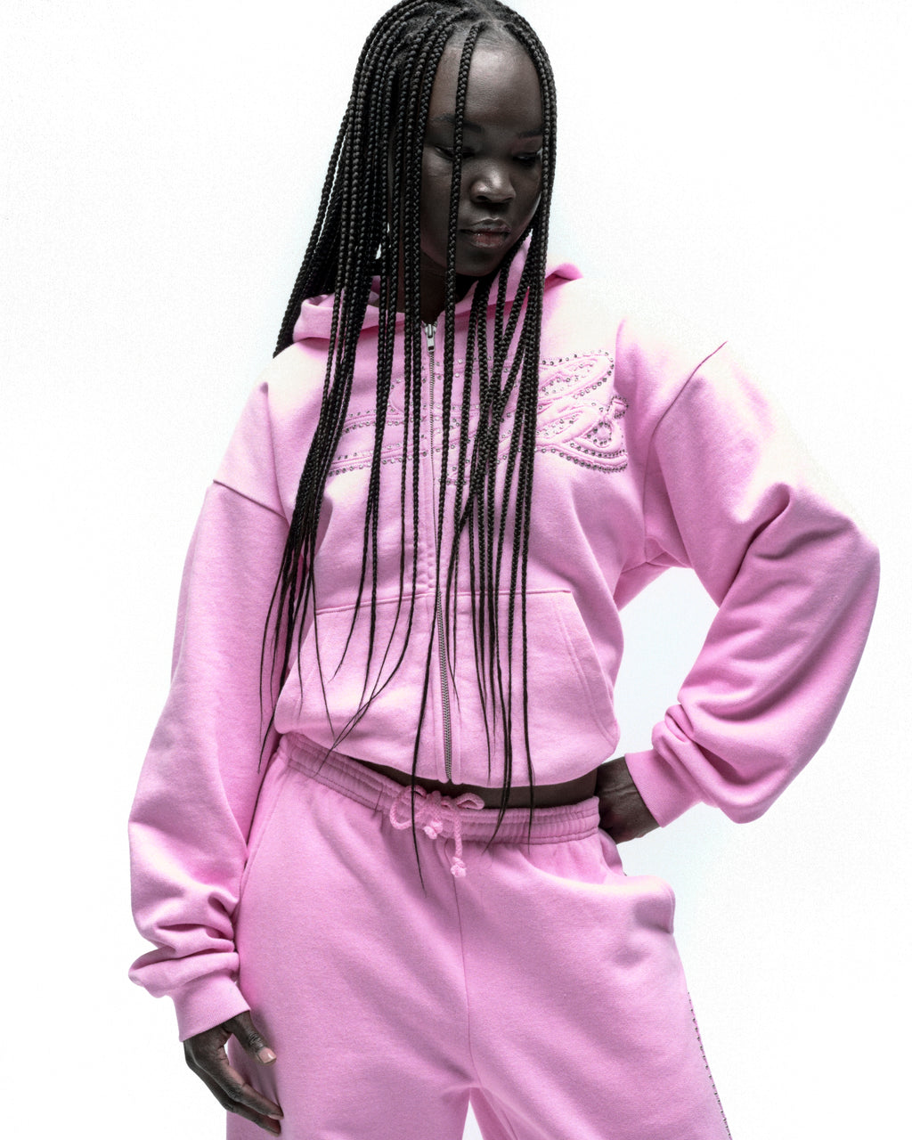 Pink fleece zip hoodie with rhinestone script design on front, paired with matching sweatpants.