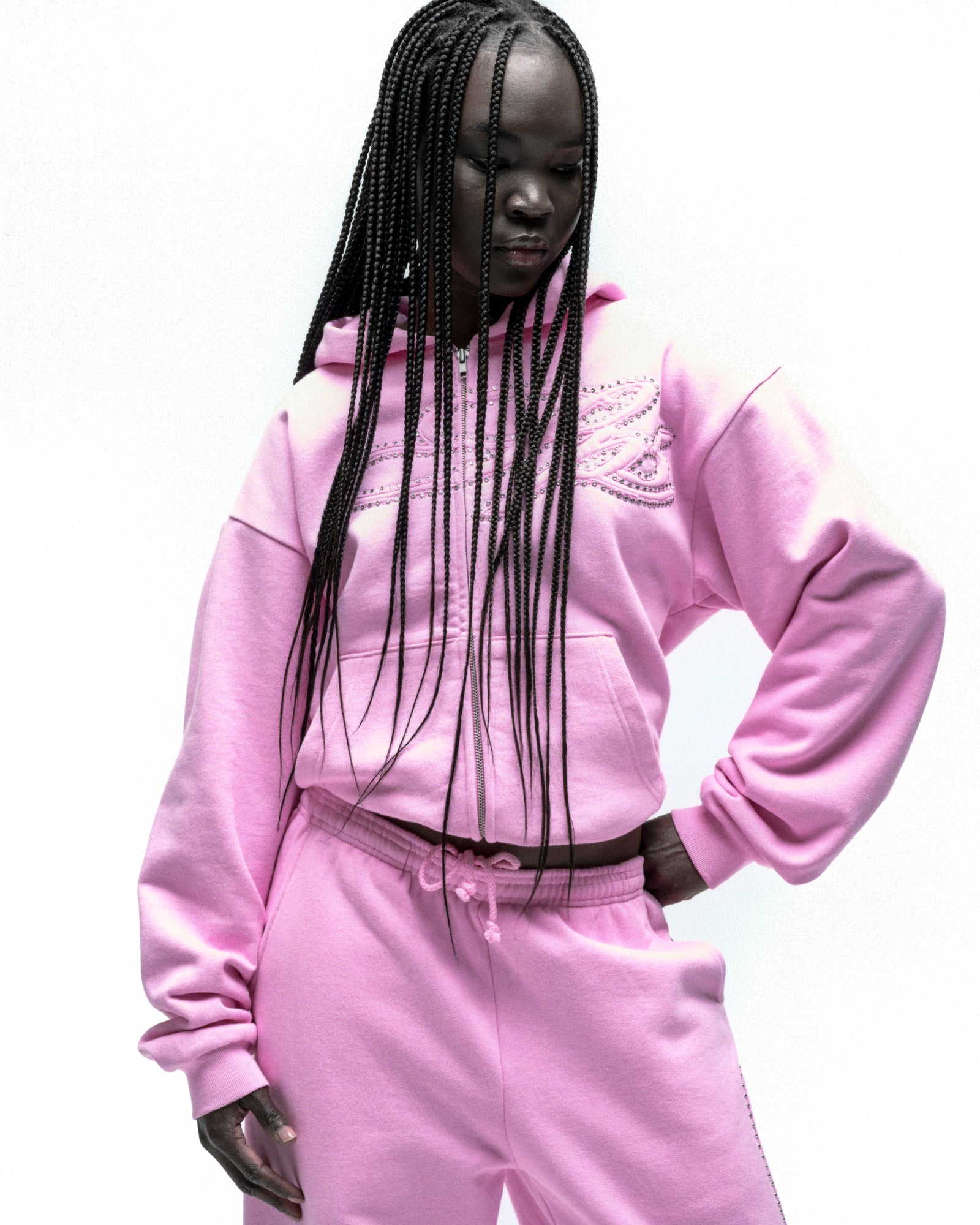 Pink fleece zip hoodie with rhinestone script design on front, paired with matching sweatpants.