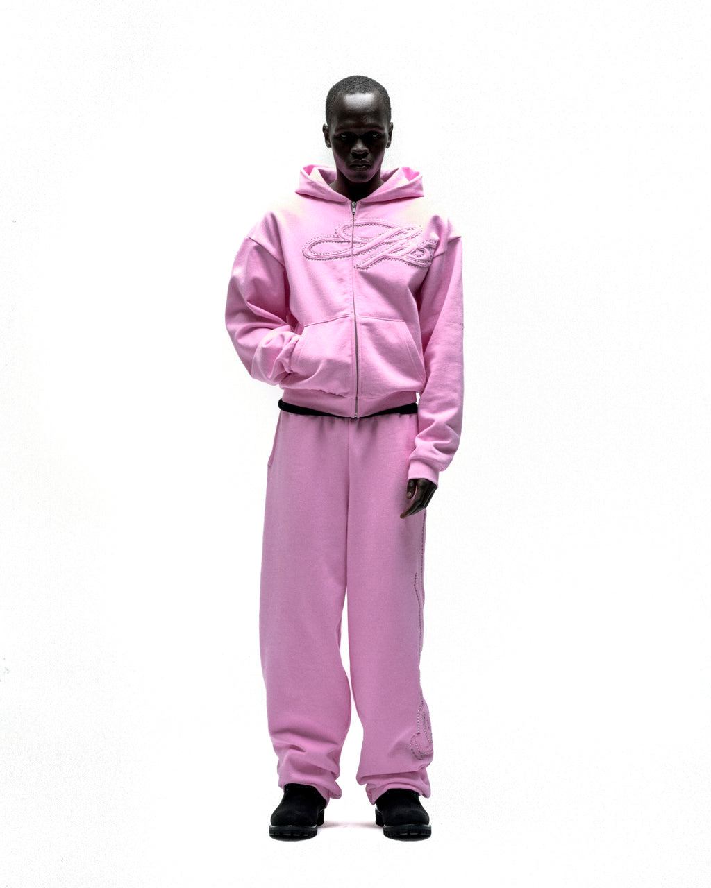 Pink 13oz cotton fleece zip hoodie and sweatpants with rhinestone script design.