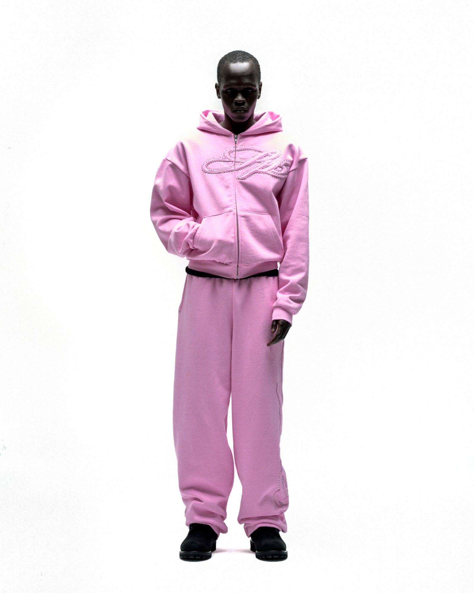 Pink 13oz cotton fleece zip hoodie and sweatpants with rhinestone script design.
