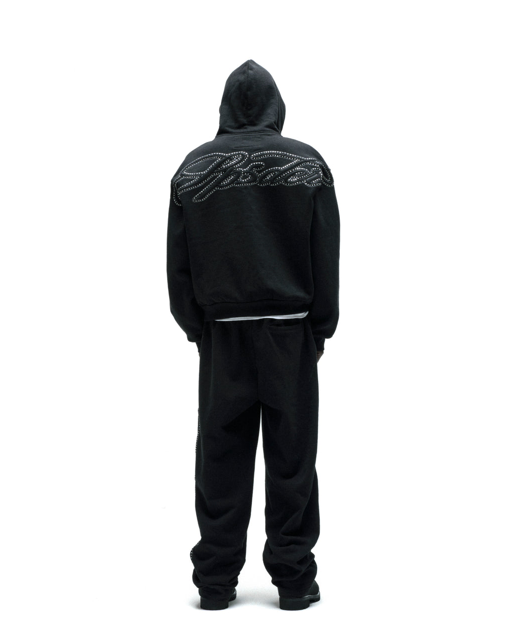 Black 13oz cotton fleece zip hoodie with rhinestone script on the back, paired with matching sweatpants.