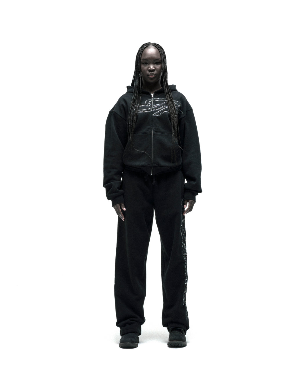 Black rhinestone script zip hoodie and sweatpants set on a model.