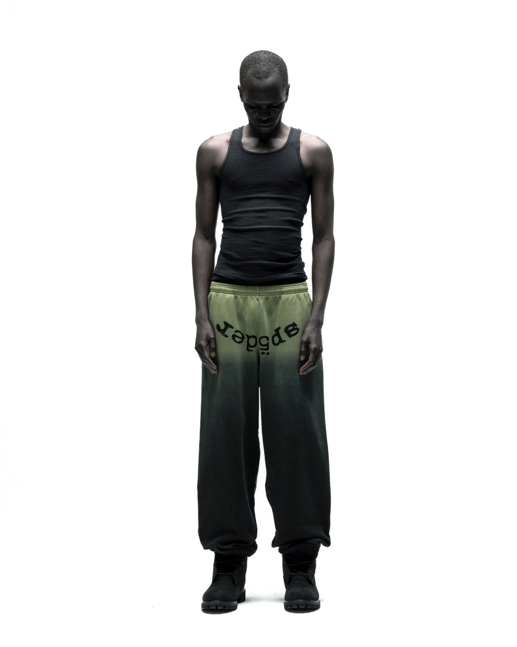 OG WEB OMBRE SWEATPANT: Black to olive green ombre cotton fleece sweatpants with "SP5DER" text at crotch.