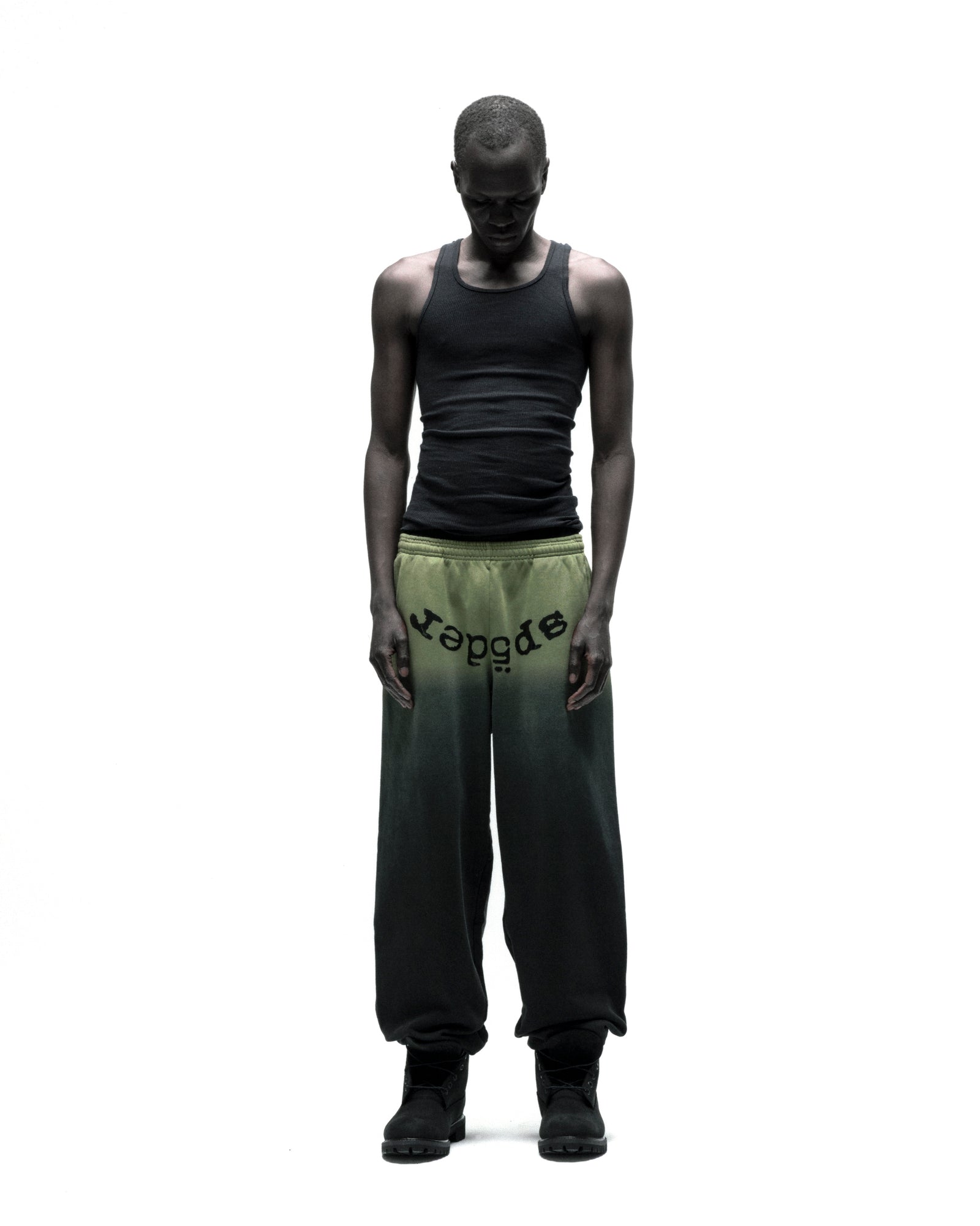 OG WEB OMBRE SWEATPANT: Black to olive green ombre cotton fleece sweatpants with "SP5DER" text at crotch.