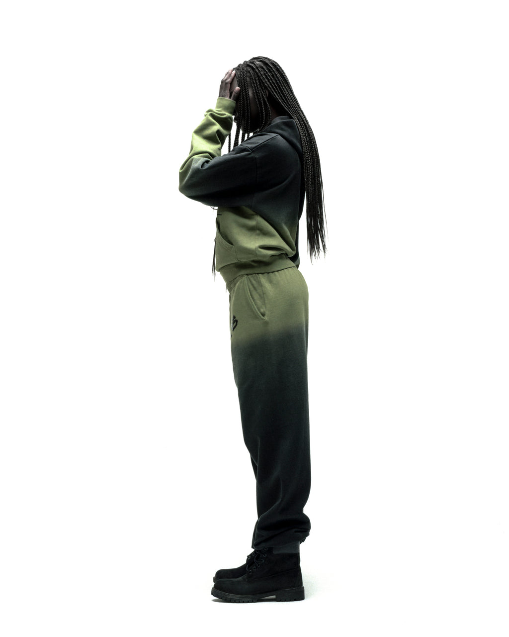 OG WEB OMBRE SWEATPANT: Black and green ombre cotton fleece sweatpants with 'SP5DER' text.