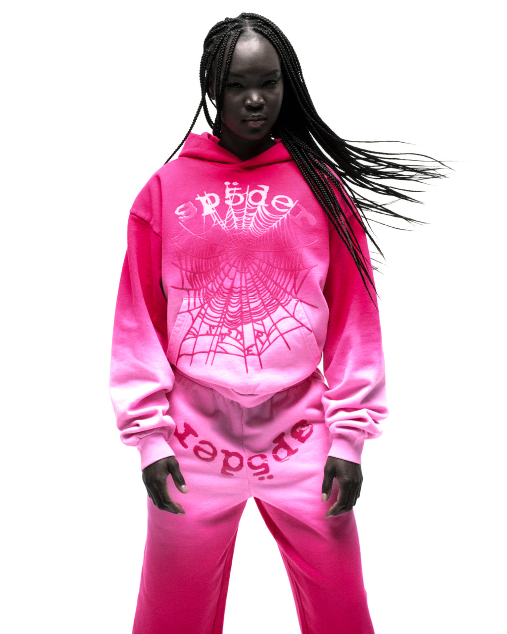 Black model in a pink ombre OG WEB HOODIE and matching sweatpants with puff print.