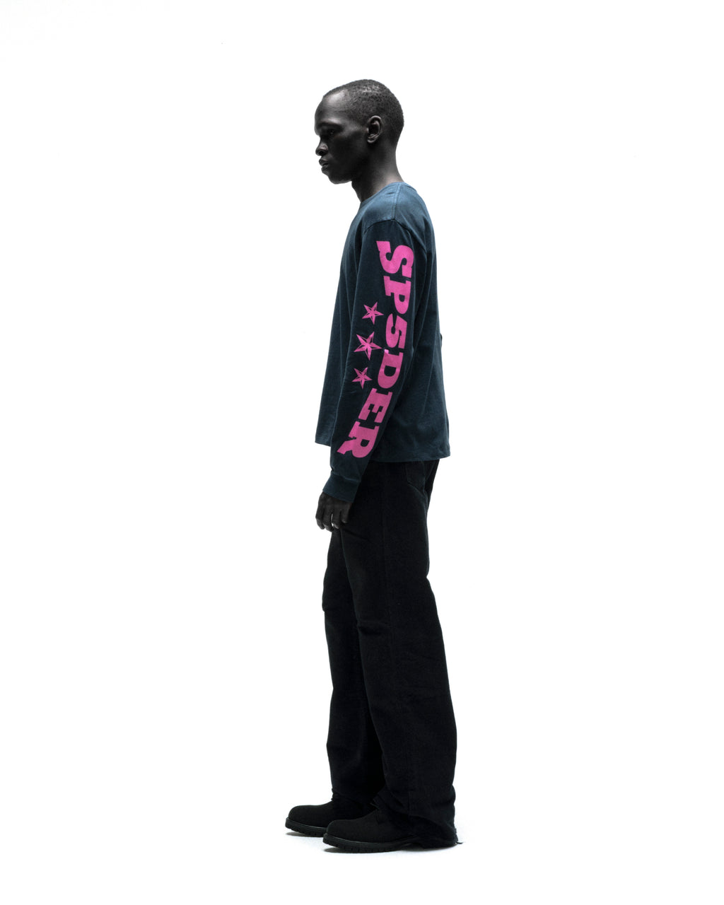 Black model in a navy MX555 long sleeve tee with pink "SPSDER" graphic and stars on the sleeve.