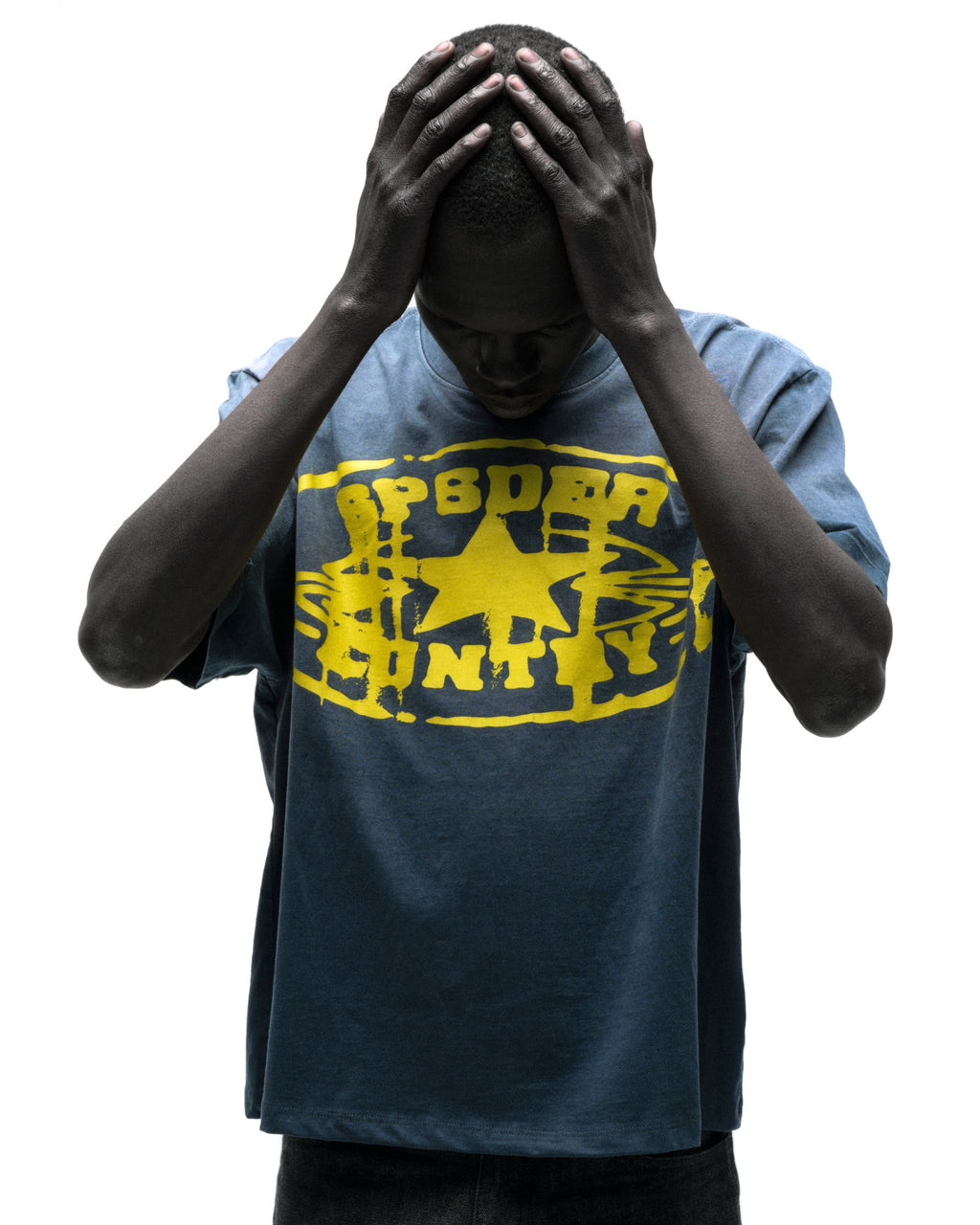 Faded blue cotton SP5DER CUNTRY TEE with yellow graphic print and star design.