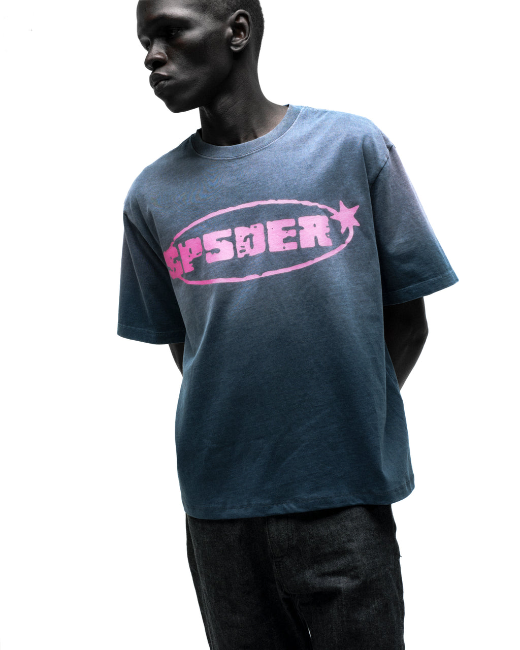 Faded blue cotton tee with a bold pink "SP5DER" graphic and star.