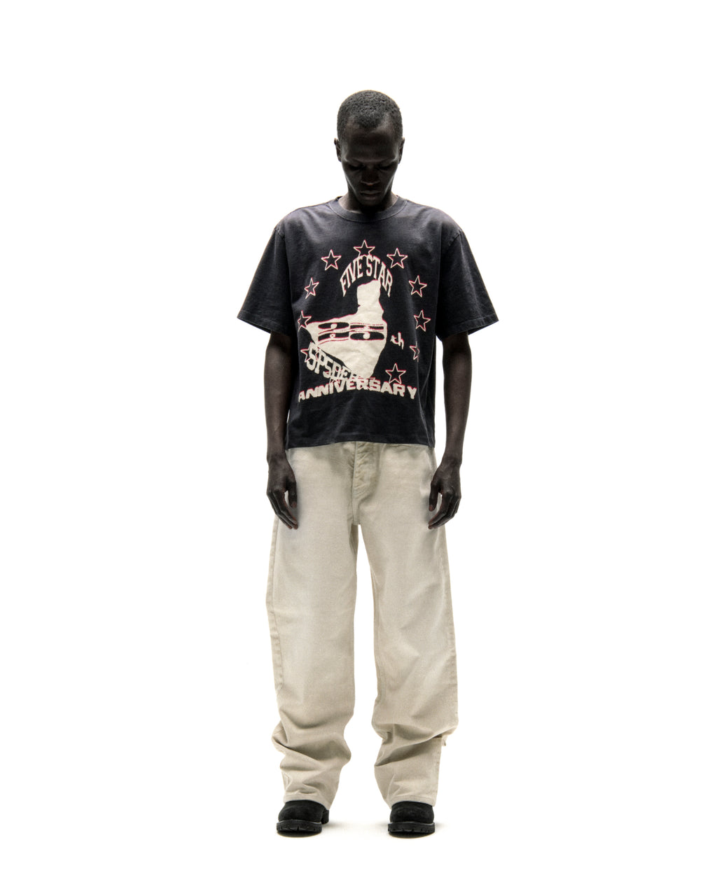 Black cotton ANNIVERSARY TEE with "FIVE STAR 25th ANNIVERSARY" graphic, worn by a man.