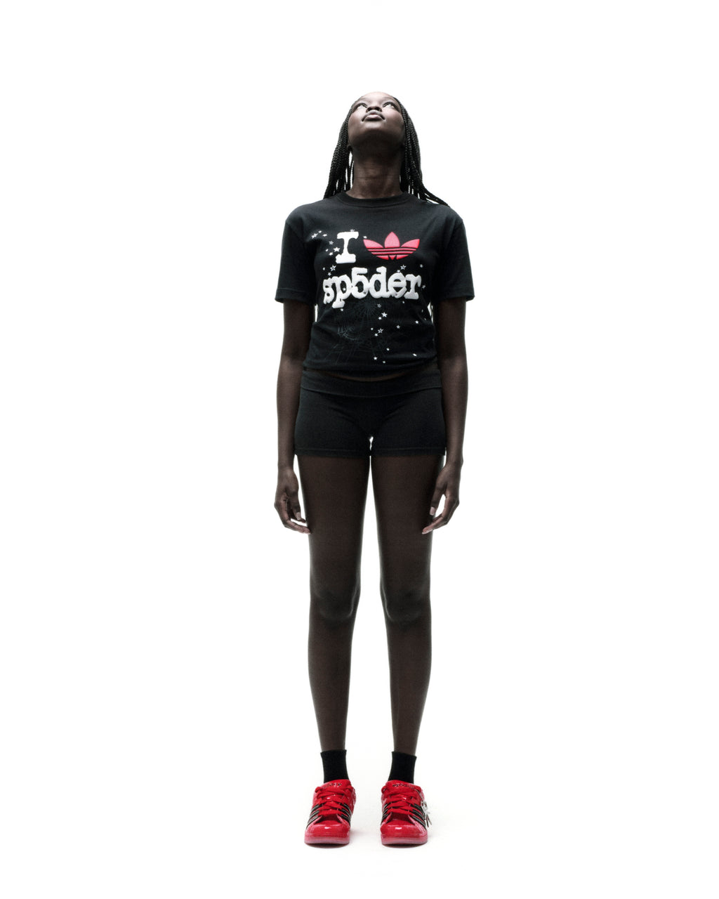 Black Adidas Souvenir Tee with red Trefoil x SP5DER graphic, worn by a model on a white background.