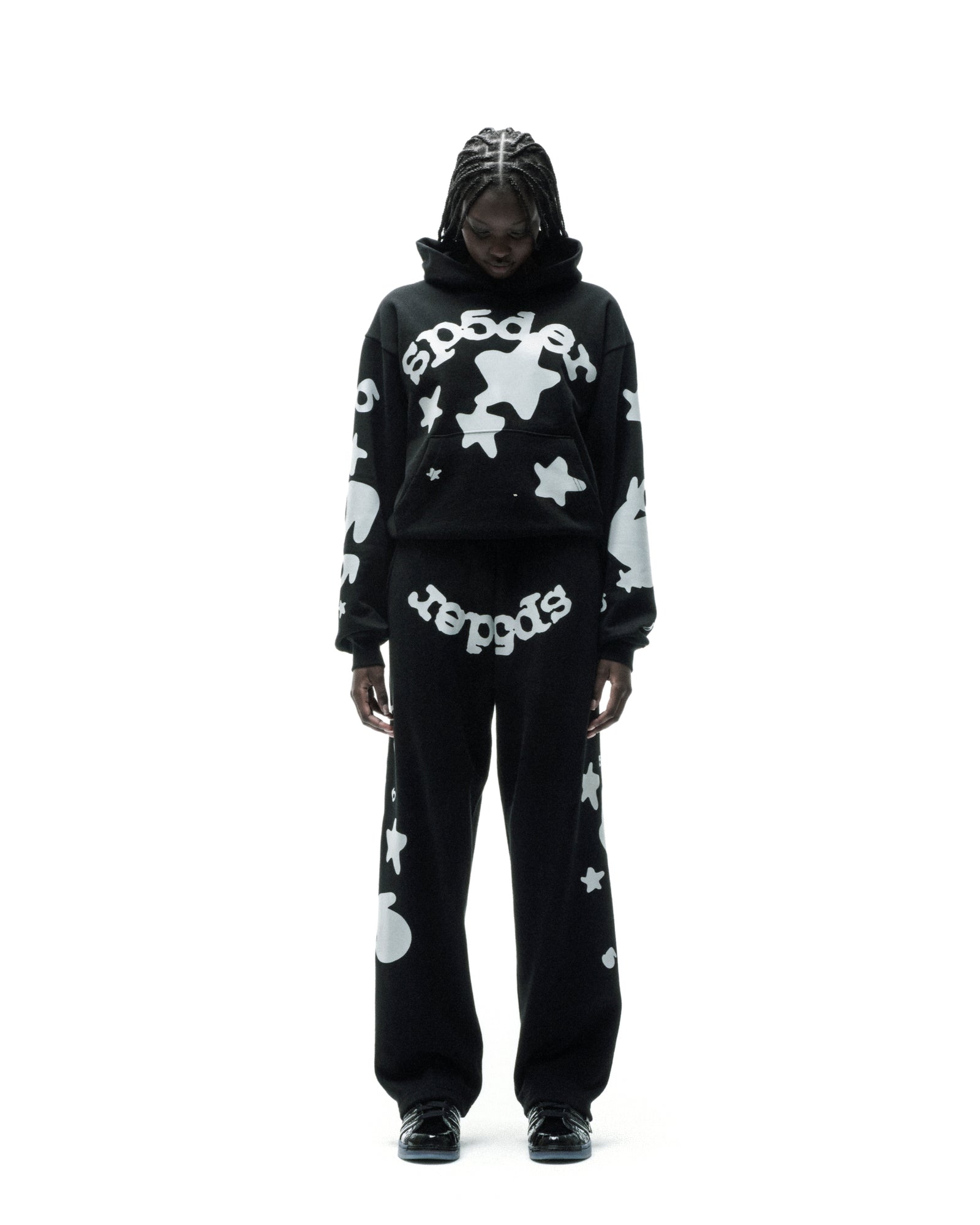 Black cotton fleece sweatpant with reflective white stars and "SP5DER" text.
