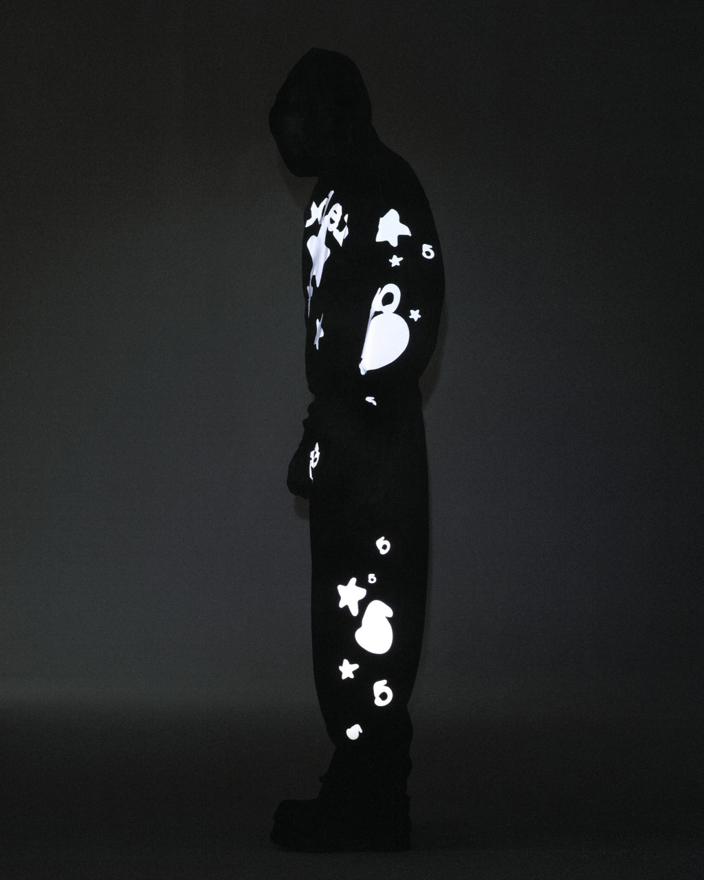 Dark REFLECTIVE BELUGA HOODIE and sweatpants set with glowing 'SP5DER' and star prints.