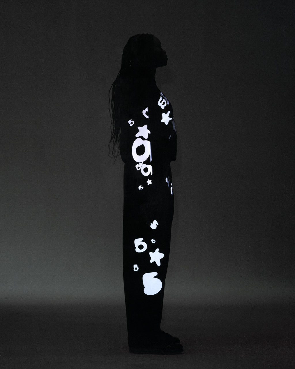Black cotton fleece sweatpant with reflective 'SP5DER' text, '5', and star designs.