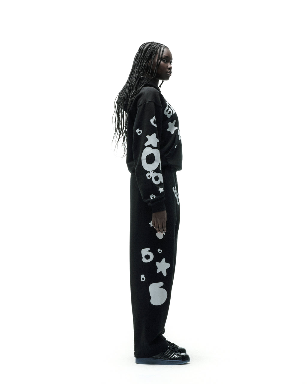 Black cotton fleece sweatpant with reflective white '5' and star designs.