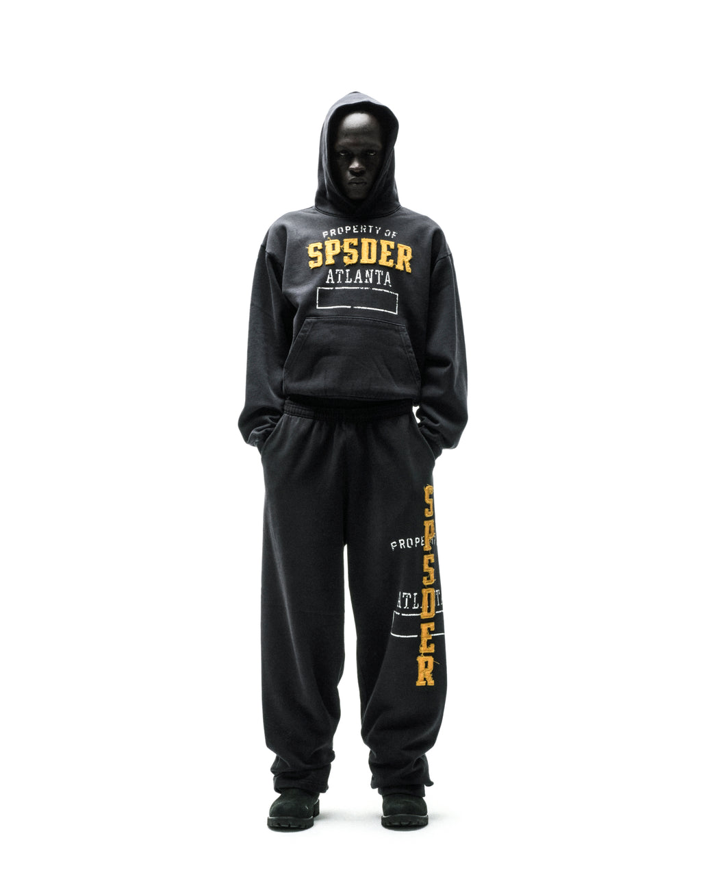 Black ISSUE 404 hoodie and sweatpants with yellow "SPSDER ATLANTA" chenille-style lettering.