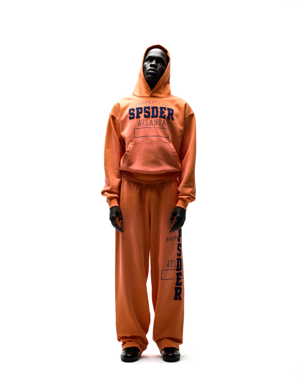 Orange ISSUE 404 hoodie and sweatpants set with raised chenille "SPSDER ATLANTA" lettering.