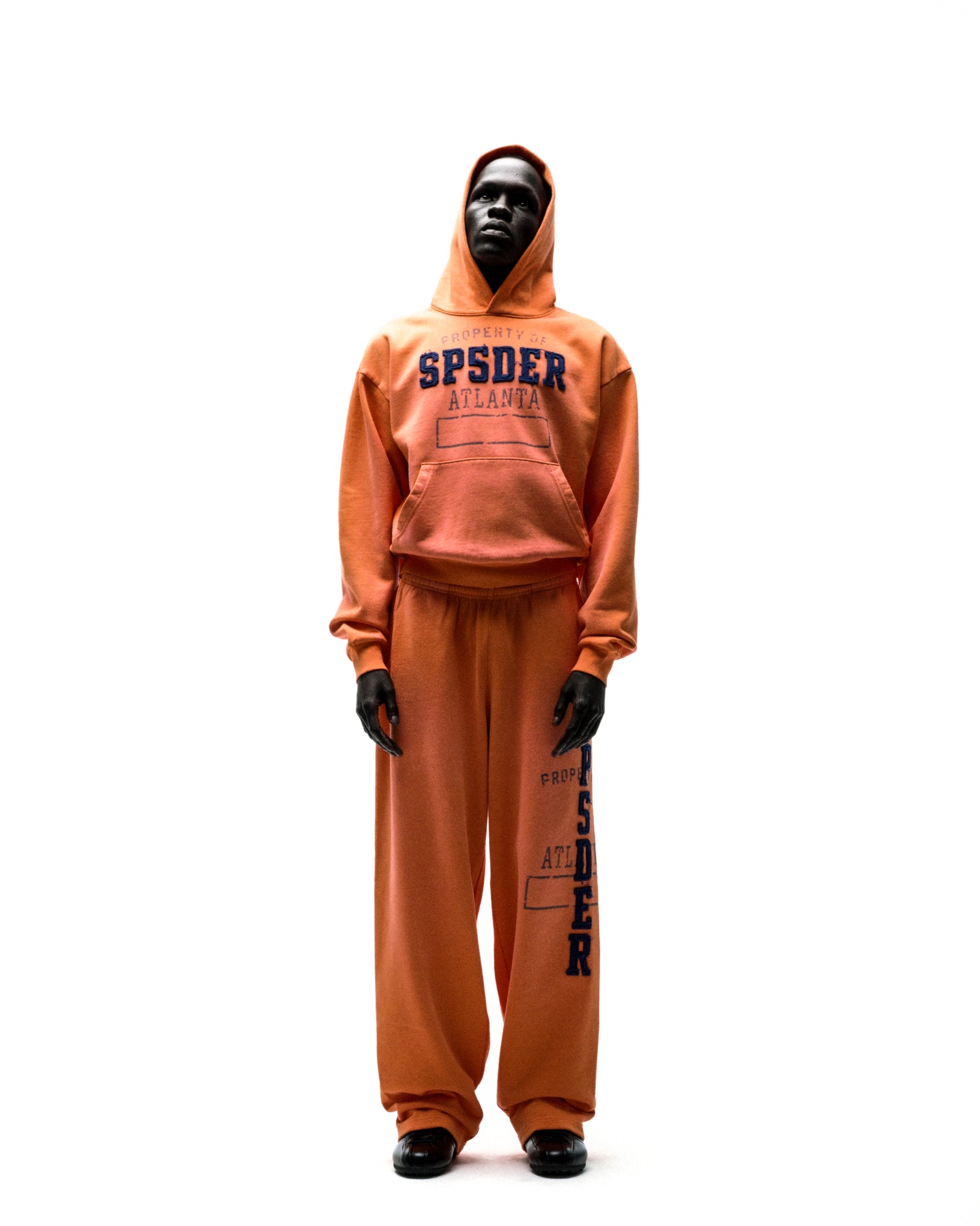 Orange ISSUE 404 hoodie and sweatpants set with raised chenille "SPSDER ATLANTA" lettering.