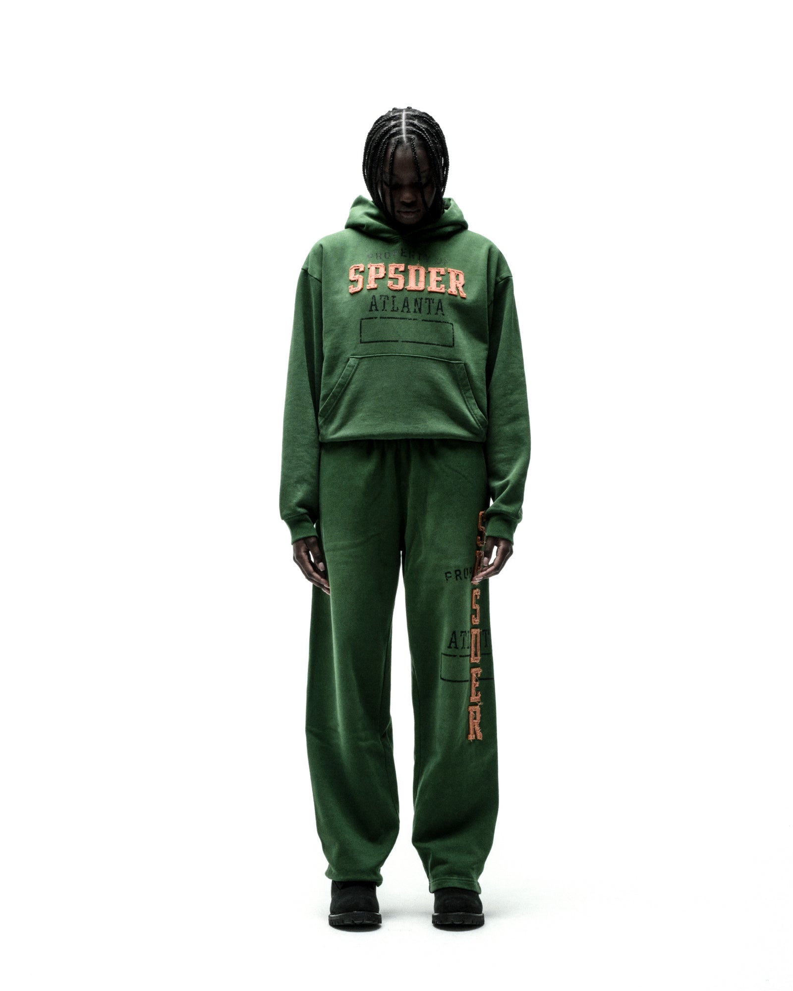 Green cotton fleece hoodie and sweatpants with raised "SPSDER ATLANTA" lettering and faded graphic print.