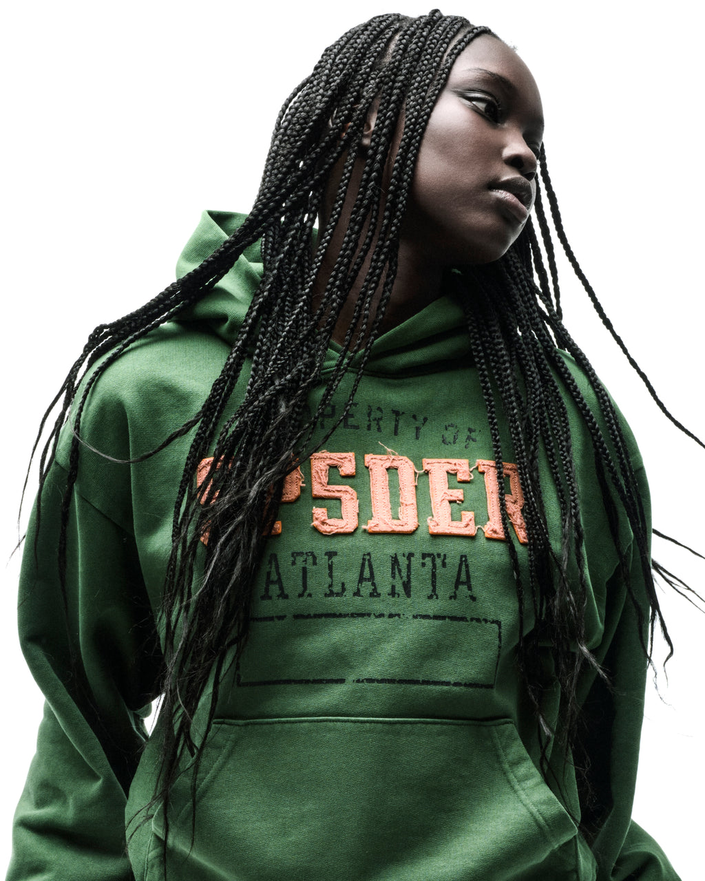 Green cotton fleece hoodie with raised orange "SPSDER" lettering and faded "PROPERTY OF ATLANTA" graphic.