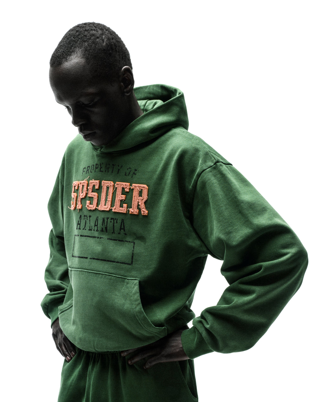 Green ISSUE 404 HOODIE with raised, frayed orange "SPSDER" lettering and faded graphic print.