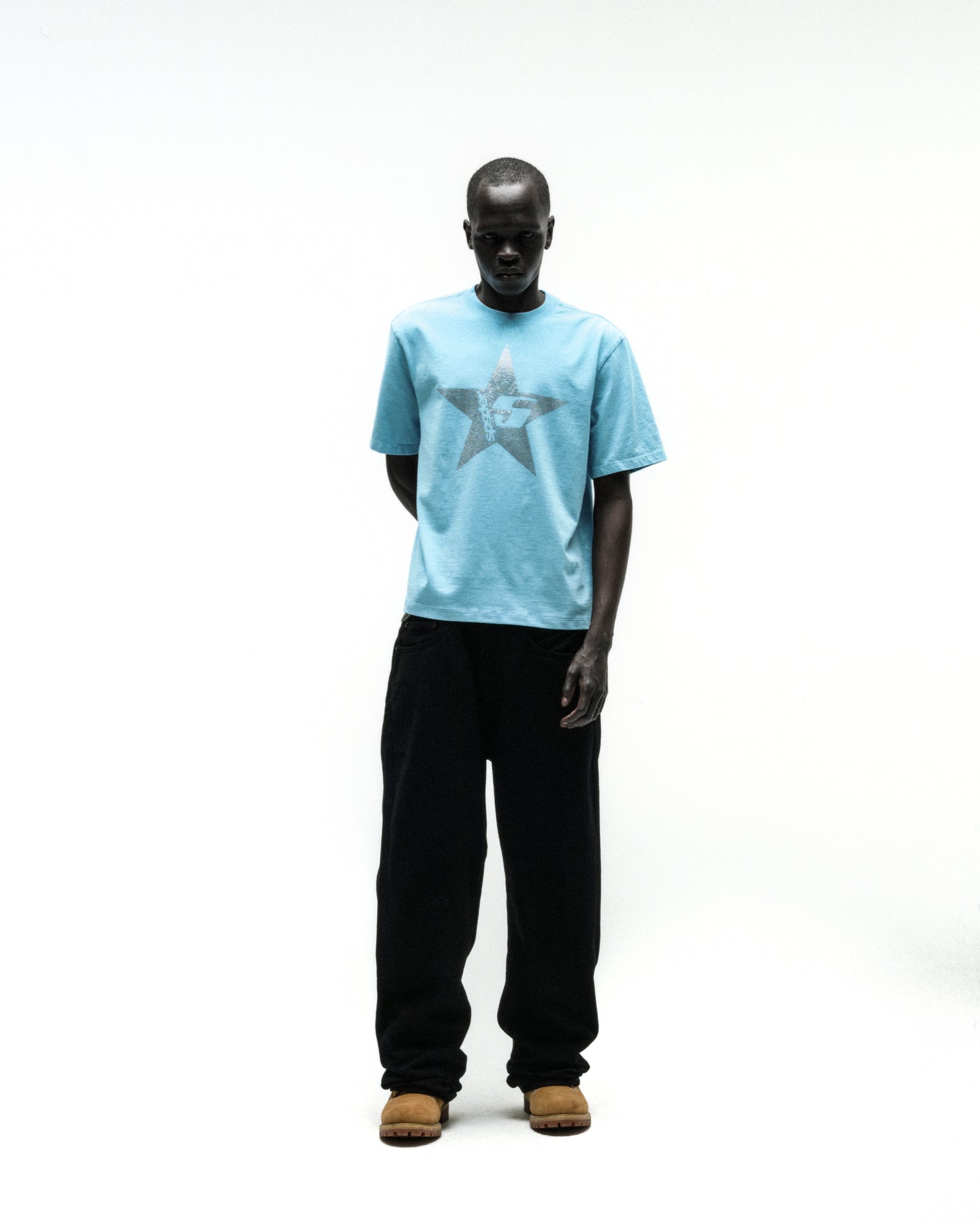 Light blue 100% cotton tee with a rhinestone embellished 5-star design, worn by a model.